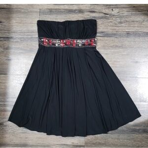 Elegant Black Strapless Dress with Red Accents